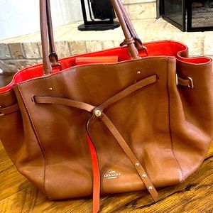 Michael kors light brown tote with coral colored inside